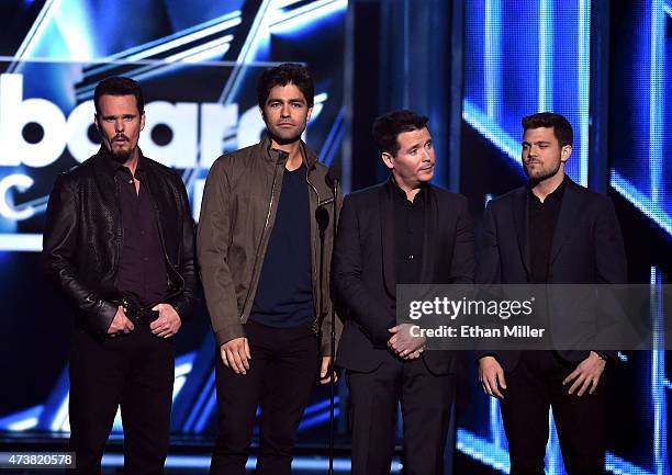 Entourage" movie cast members Kevin Dillon, Adrian Grenier, Kevin Connolly and Jerry Ferrara present the Top Artist award during the 2015 Billboard...