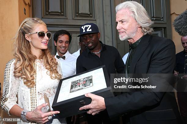 Dr. Hermann Buehlbecker, sole owner of Lambertz Group, Sponsor and Member of the Event Committee , Paris Hilton during the Hollywood Domino event at...