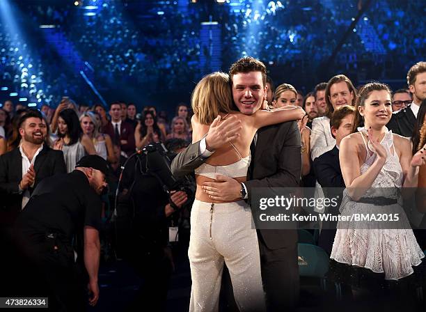 Musician Taylor Swift embraces brother Austin Swift after winning the Top Artist award at the 2015 Billboard Music Awards at MGM Grand Garden Arena...