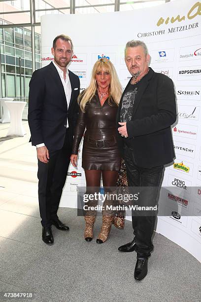 Christoph Metzelder and Host Kordes and his wife Karina pose during the pre golf party of the 7th Golf Charity Cup hosted by the Christoph Metzelder...