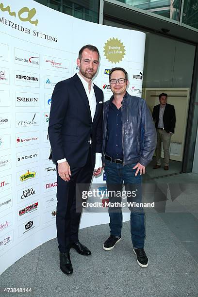 Matthias Opdenhoevel and Christoph Metzelder pose during the pre golf party of the 7th Golf Charity Cup hosted by the Christoph Metzelder Foundation...