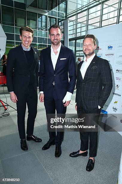 Bastian Ammelounx, Christoph Metzelder and Veith Gaertner pose during the pre golf party of the 7th Golf Charity Cup hosted by the Christoph...