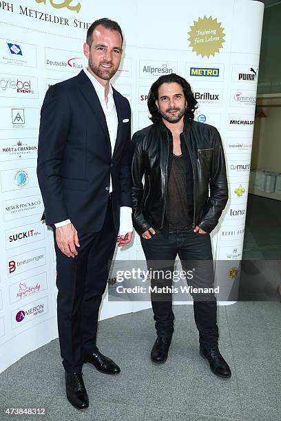 Christoph Metzelder and Marc Terenzi pose during the pre golf party of the 7th Golf Charity Cup hosted by the Christoph Metzelder Foundation on May...