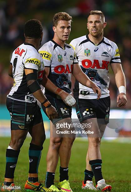 James Segeyaro, Matt Moylan and Bryce Cartwright of the Panthers celebrate after Moylan kicked a field goal during the round 10 NRL match between the...