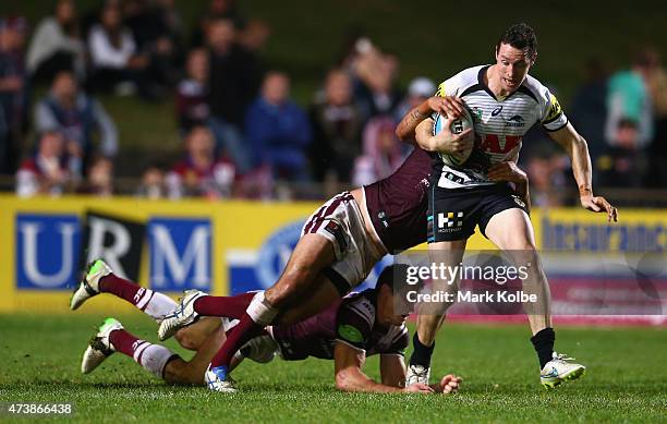 David Simmons of the Panthers is tackled during the round 10 NRL match between the Manly Sea Eagles and the Penrith Panthers at Brookvale Oval on May...