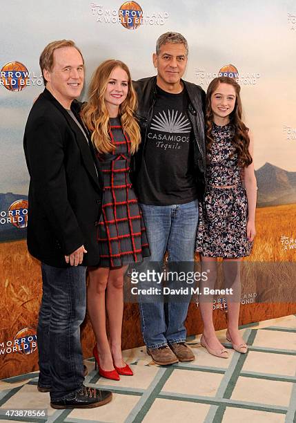 Brad Bird, Britt Robertson, George Clooney and Raffey Cassidy pose at a photocall for "Tomorrowland" at Claridge's Hotel on May 18, 2015 in London,...