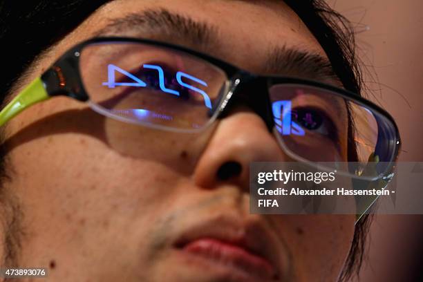 Subaru Sagano of Japan plays at the PS4 during the group stage of the finale for FIFA Interactive World Cup 2015 at Palais am Lenbachplatz on May 18,...