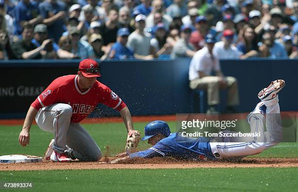 Ryan Goins of the Toronto Blue Jays is tagged out at third base trying to advance on a double by Josh Donaldson in the second inning during MLB game...
