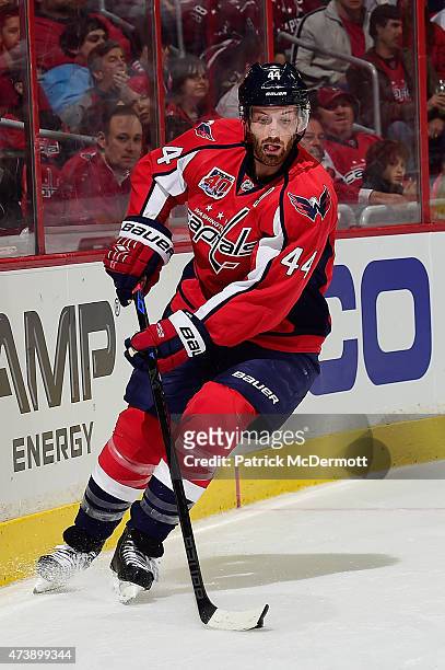 Brooks Orpik of the Washington Capitals controls the puck against the New York Islanders during the first period in Game Seven of the Eastern...