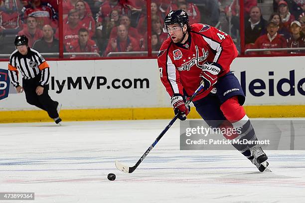 Tom Wilson of the Washington Capitals controls the puck against the New York Islanders during the second period in Game Seven of the Eastern...