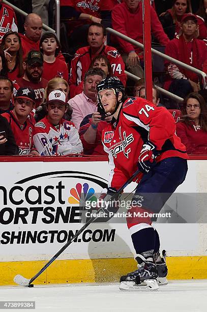 John Carlson of the Washington Capitals controls the puck against the New York Islanders during the second period in Game Seven of the Eastern...