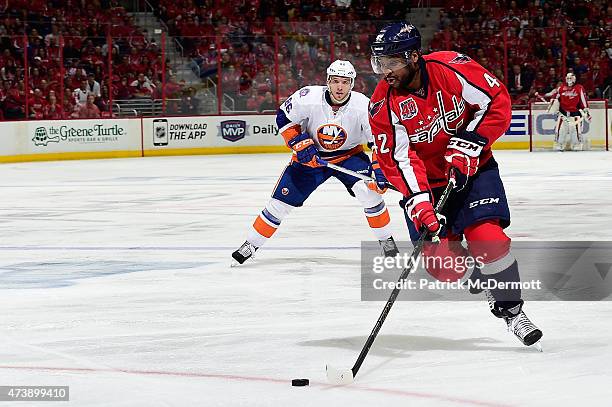 Joel Ward of the Washington Capitals controls the puck against the New York Islanders during the second period in Game Seven of the Eastern...