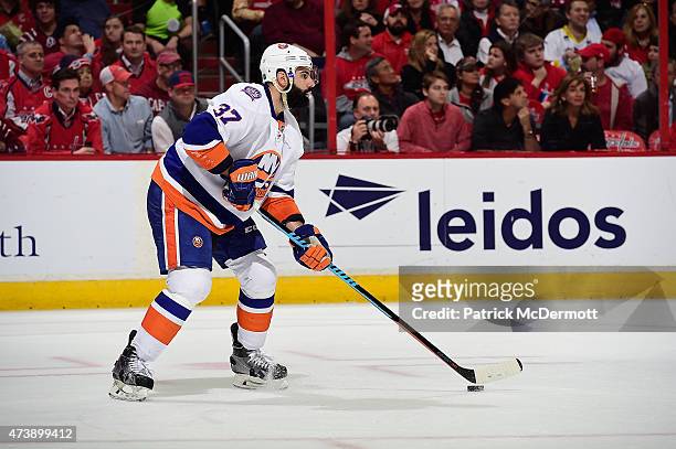Brian Strait of the New York Islanders controls the puck against the Washington Capitals during the second period in Game Seven of the Eastern...
