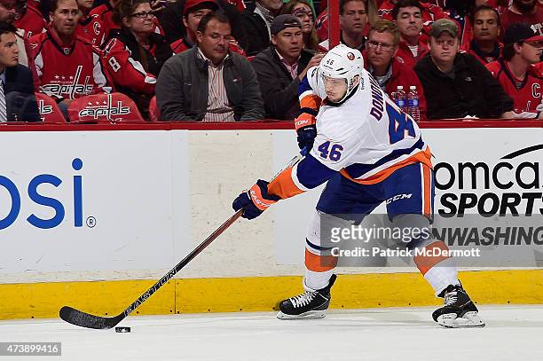 Matt Donovan of the New York Islanders controls the puck against the Washington Capitals during the second period in Game Seven of the Eastern...