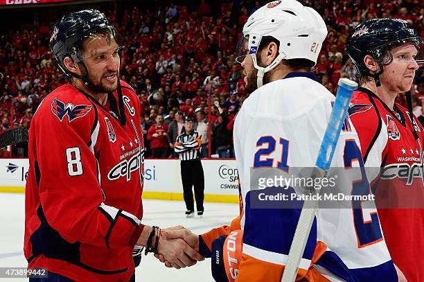 Alex Ovechkin of the Washington Capitals and Kyle Okposo of the New York Islanders shake hands following the Capitals victory over the Islanders in...