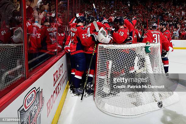 The Washington Capitals celebrate after defeating the New York Islanders 2-1 in Game Seven of the Eastern Conference Quarterfinals during the 2015...