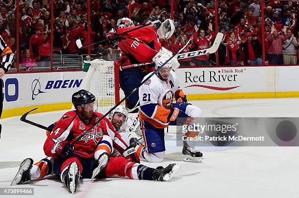 Braden Holtby and John Carlson of the Washington Capitals celebrate after the Capitals defeated the in Game Seven of the Eastern Conference...