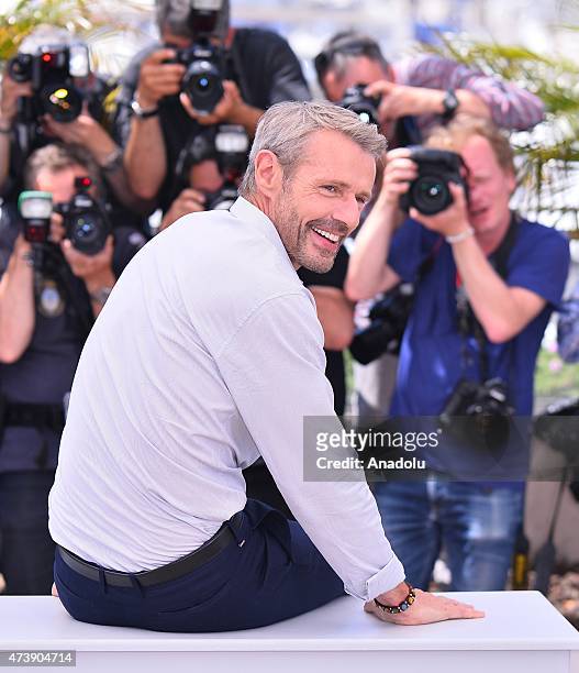French actor Lambert Wilson poses during the photocall for the film 'Enrages' at the 68th Cannes Film Festival on May 18, 2015 in Cannes, France.