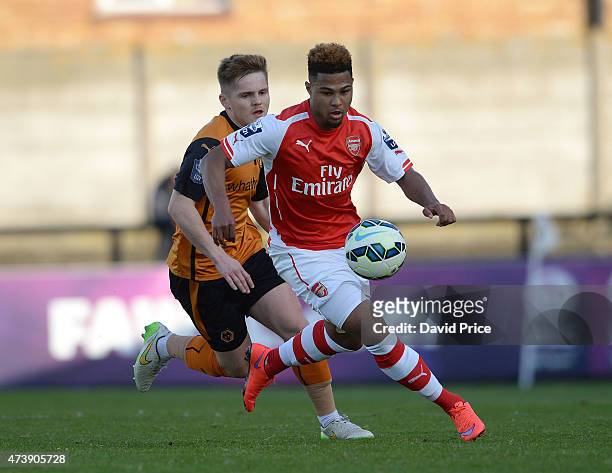 Serge Gnabry of Arsenal takes on Declan Weeks of Wolves during the match between Arsenal U21s and Wolverhampton Wanderers U21s at Meadow Park on May...