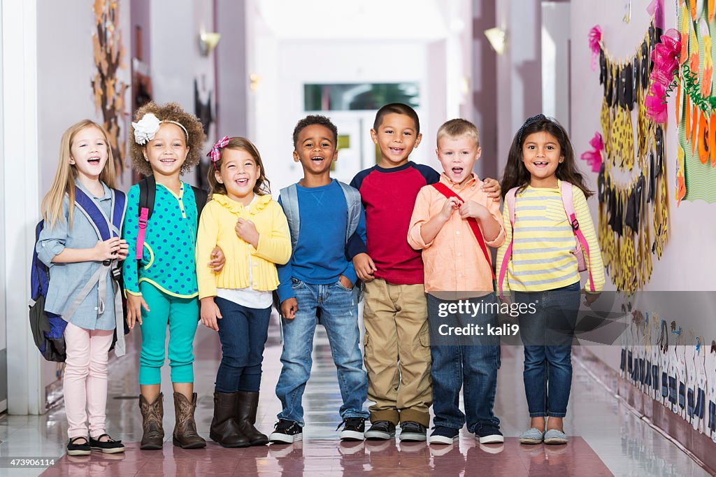 Multiracial group of children in preschool hallway