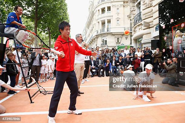 Japanese tennis player Kei Nishikori participates to the Association Theodora fund event organized by Tag Heuer on May 18, 2015 in Paris, France.