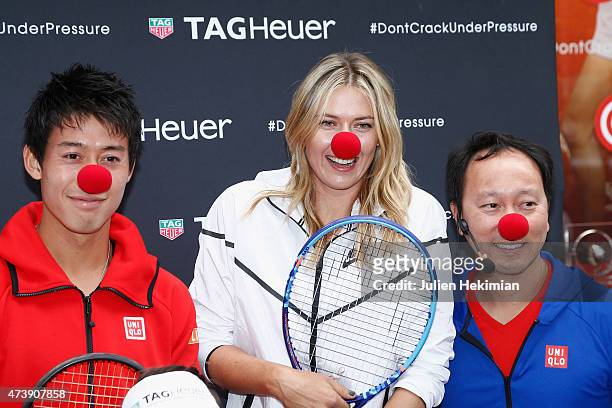 Japanese tennis player Kei Nishikori, Russian tennis player Maria Sharapova and former American tennis player Michael Chang pose with a red nose to...