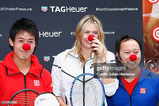 Japanese tennis player Kei Nishikori, Russian tennis player Maria Sharapova and former American tennis player Michael Chang pose with a red nose to...