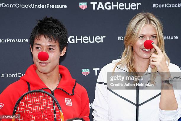 Japanese tennis player Kei Nishikori and Russian tennis player Maria Sharapova pose with a red nose to support the Association Theodora fund event...