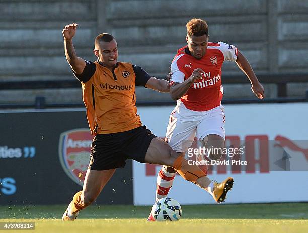 Serge Gnabry of Arsenal takes on Connor Hunte of Wolves during the match between Arsenal U21s and Wolverhampton Wanderers U21s at Meadow Park on May...