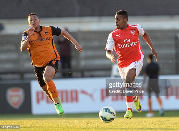 Tyrell Robinson of Arsenal takes on Aaron Simpson of Wolves during the match between Arsenal U21s and Wolverhampton Wanderers U21s at Meadow Park on...