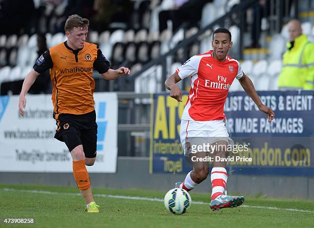 Isaac Hayden of Arsenal passes the ball awy from Ryan Rainey of Wolves during the match between Arsenal U21s and Wolverhampton Wanderers U21s at...