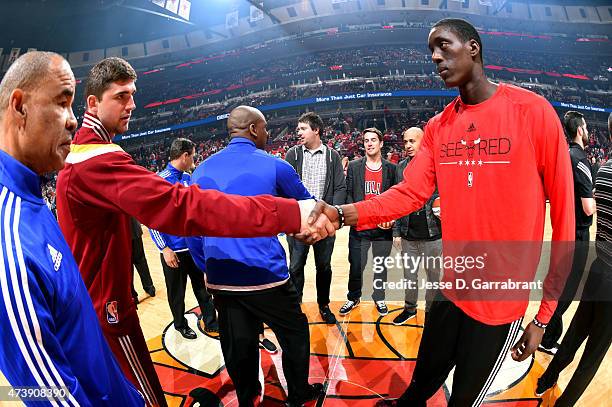 Joe Harris of the Cleveland Cavaliers and Tony Snell of the Chicago Bulls shake hands before a game against the Cleveland Cavaliers in Game Six of...