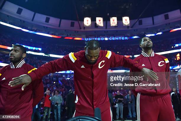 LeBron James of the Cleveland Cavaliers stands for the national anthem before a game against the Chicago Bulls in Game Six of the Eastern Conference...