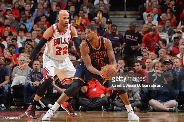 Tristan Thompson of the Cleveland Cavaliers handles the ball against Taj Gibson of the Chicago Bulls in Game Six of the Eastern Conference Semifinals...