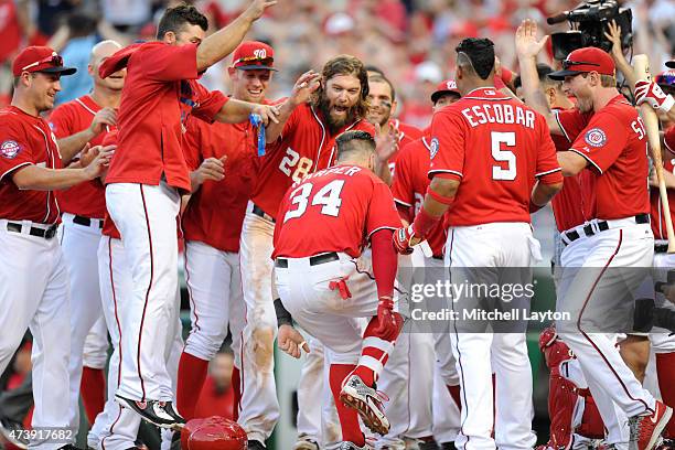 Bryce Harper of the Washington Nationals celebrates a walk off home run during a baseball game against the Atlanta Braves at National Park on May 9,...