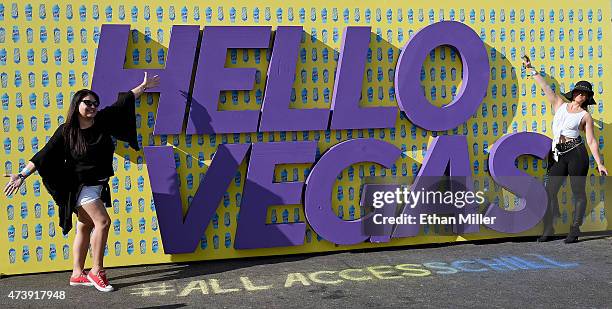 Festival attendees Natalia Rios and Danielle Haugan, both of Nevada, pose in front of a "Hello Vegas" sign during Rock in Rio USA at the MGM Resorts...