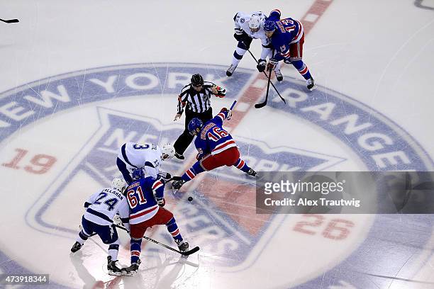 Cedric Paquette of the Tampa Bay Lightning faces off against Derick Brassard of the New York Rangers to start Game Two of the Eastern Conference...