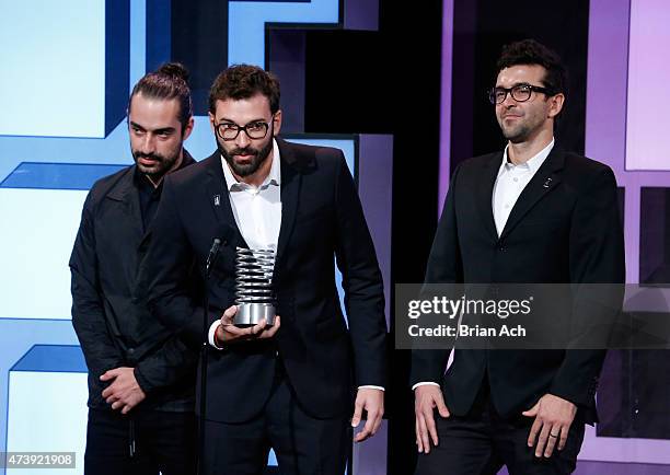 Joao Cavalcanti, Lucas Mello, and Mauro Silva of LiveAD accept an award for Advertising & Media/Social at the 19th Annual Webby Awards on May 18,...