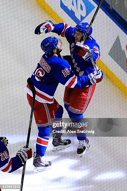 Derek Stepan of the New York Rangers celebrates with his teammates after scoring a goal in the second period against Ben Bishop of the Tampa Bay...