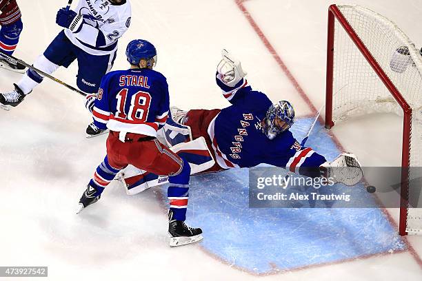 Henrik Lundqvist of the New York Rangers gives up a goal to Alex Killorn of the Tampa Bay Lightning in the third period during Game Two of the...