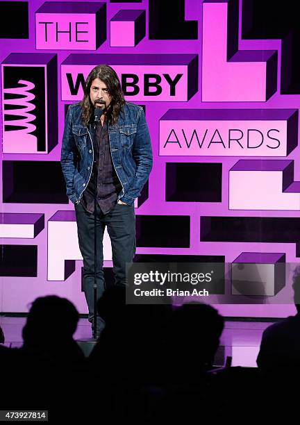 Musician Dave Grohl presents an award on stage at the 19th Annual Webby Awards on May 18, 2015 in New York City.