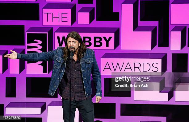 Musician Dave Grohl presents an award on stage at the 19th Annual Webby Awards on May 18, 2015 in New York City.