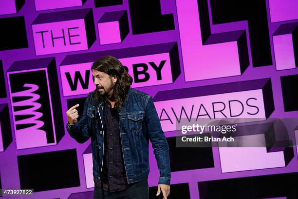 Musician Dave Grohl presents an award on stage at the 19th Annual Webby Awards on May 18, 2015 in New York City.