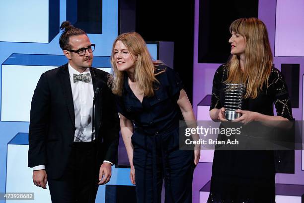 Pablo Bio, Melissa Denes, and Alicia Smith of the National Film Board of Canada accept an award for Websites during the 19th Annual Webby Awards on...