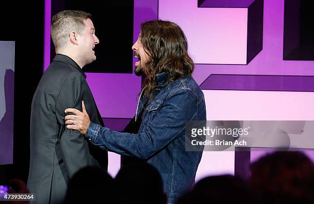 Pat Quinn and Dave Grohl appear on stage during the 19th Annual Webby Awards on May 18, 2015 in New York City.