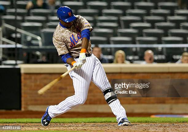 John Mayberry Jr. #44 of the New York Mets drives in the game winning run in the bottom of the 14th inning against the St. Louis Cardinals on May 18,...
