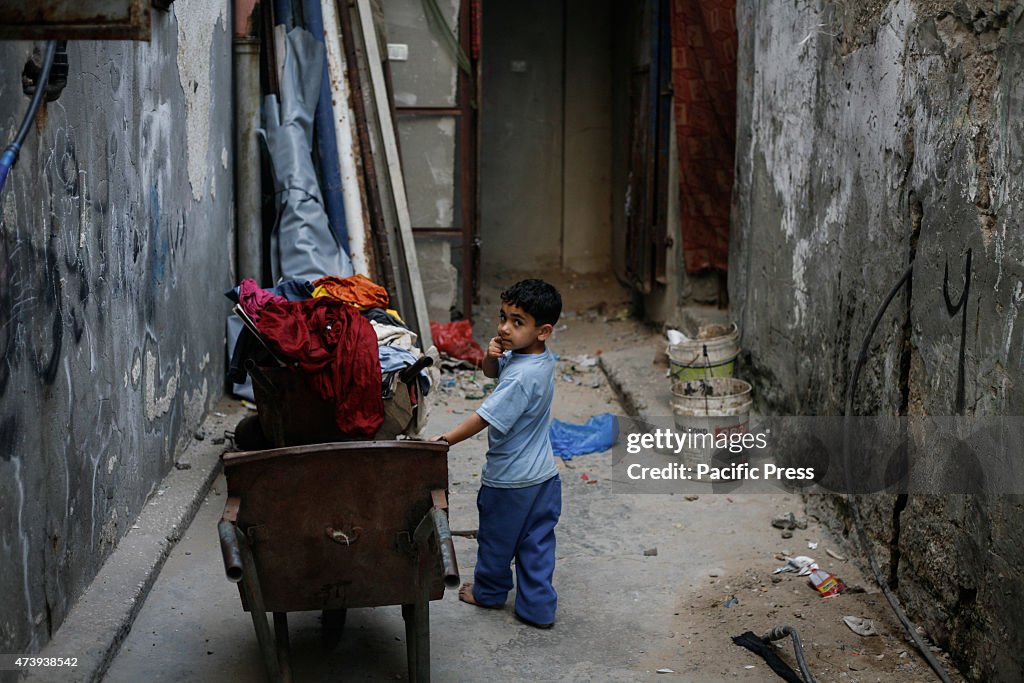 Palestinian child playing in front of their home in the...