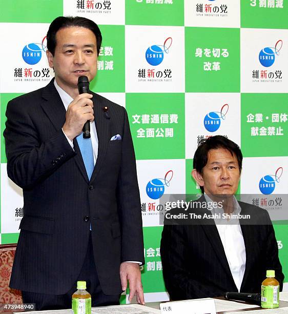 Japan Innovation Party leader Kenji Eda speaks while the party secretary general Yorihisa Matsuno listens during the party executive meeting at the...