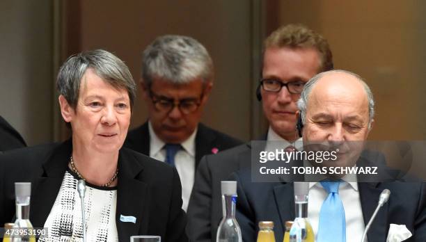 German Environment Minister Barbara Hendricks and French Foreign Minister Laurent Fabius attend the Petersberg Climate Dialogue conference on May 19,...