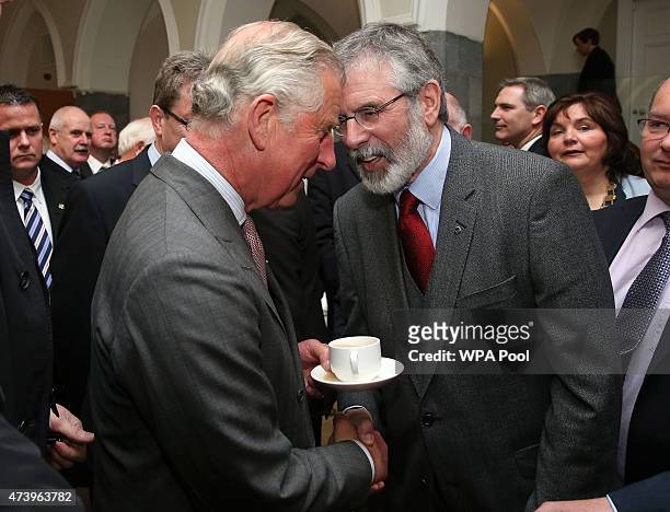 Prince Charles, Prince Of Wales shakes hands with Sinn Fein president Gerry Adams at the National University of Ireland on May 19, 2015 in Galway,...